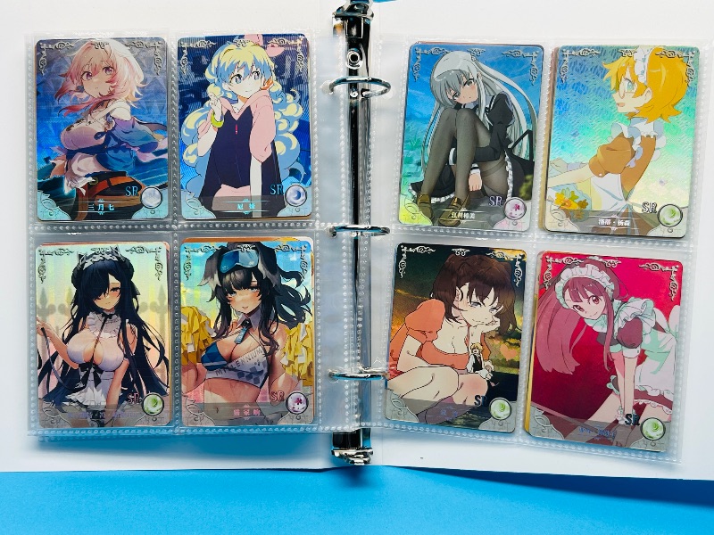 Photo 1 of 025574… final sale no return/refund-80 misc holo asian Anime cards in binder