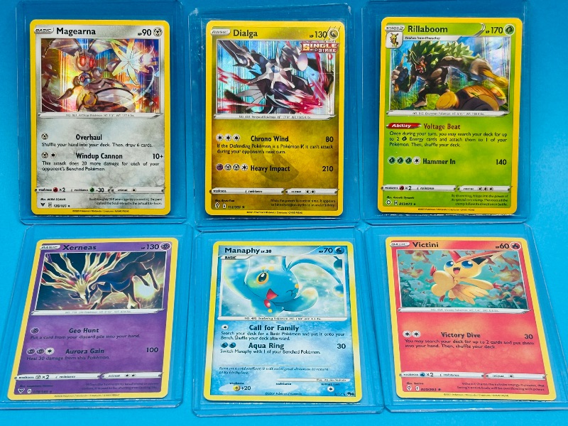 Photo 1 of 025597… 6 holo  Pokémon cards in hard plastic sleeves 
