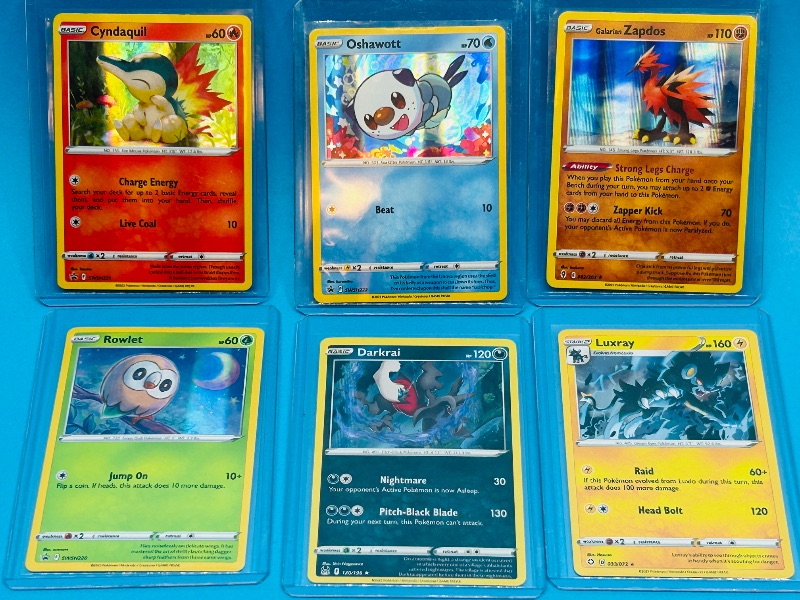 Photo 1 of 025599… 6  holo  Pokémon cards in hard plastic sleeves 