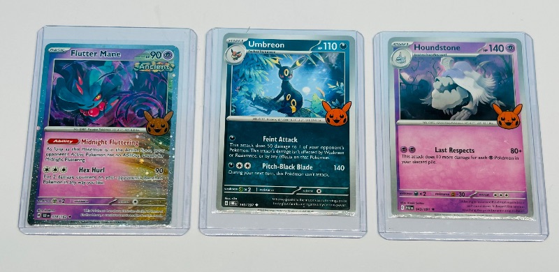 Photo 1 of 025601…3 Pokémon trick or trade cards in hard plastic sleeves 