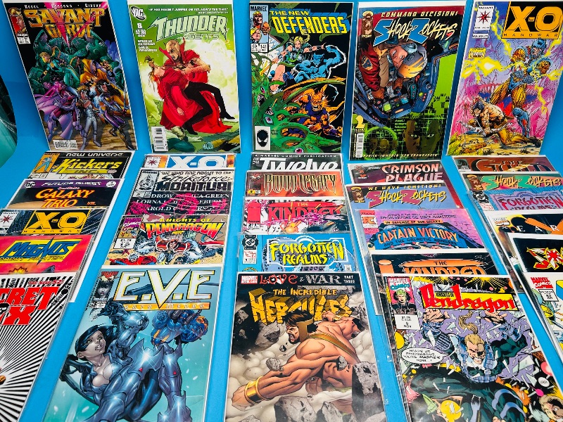 Photo 1 of 025702… final sale no return/refund- 30 misc comics in plastic sleeves