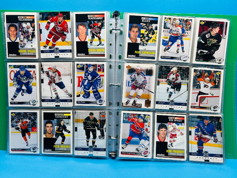Photo 1 of 025719…  final sale no return/refund -270 mixed Hockey  cards in binder