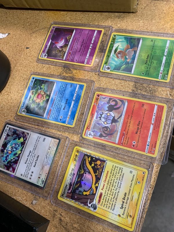 Photo 1 of 025758… 6 holo Pokémon cards in hard plastic sleeves