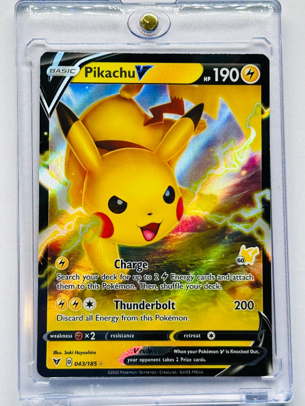 Photo 1 of 025759…Pikachu V holo Pokémon card in hard plastic case