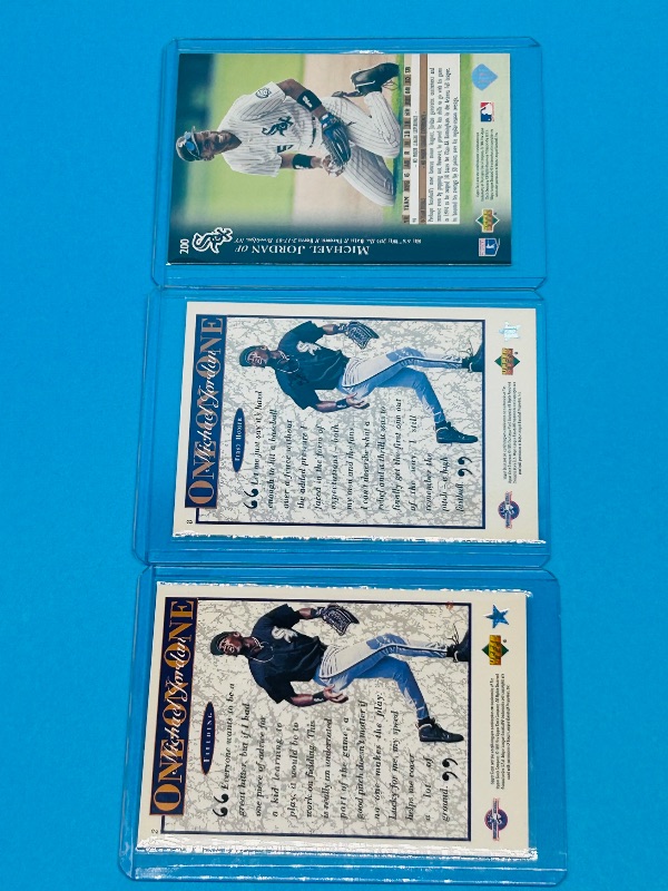 Photo 1 of 025764…3 Michael Jordan card in hard plastic sleeves
