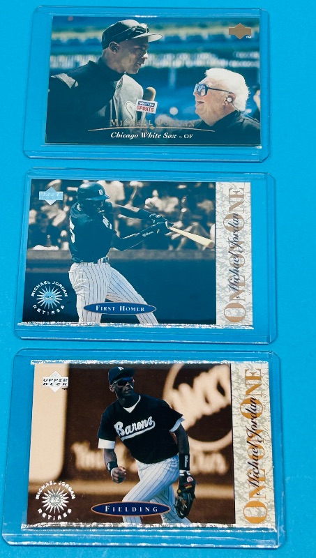 Photo 1 of 025764…3 Michael Jordan card in hard plastic sleeves