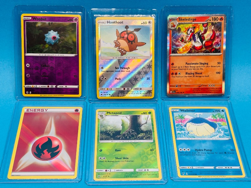 View 1 of 025805… 6 reverse holo Pokémon cards in hard plastic sleeves 
