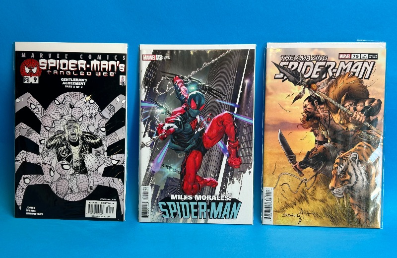 Photo 1 of 025975…3 Spider-Man  comics in plastic sleeves 