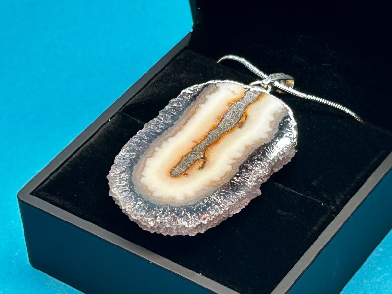 View 1 of 026012… amethyst stalactite slice pendant on 16” chain in lighted gift box