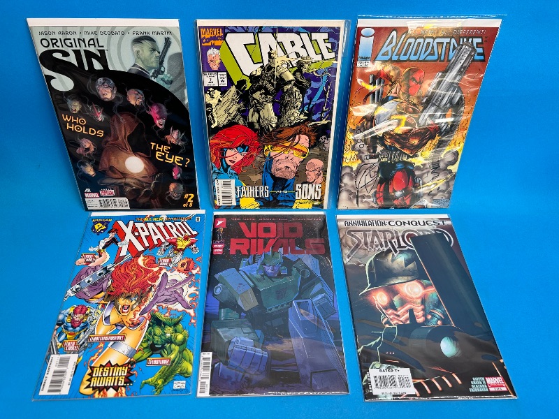 Photo 1 of 026095…6  comics in plastic sleeves 