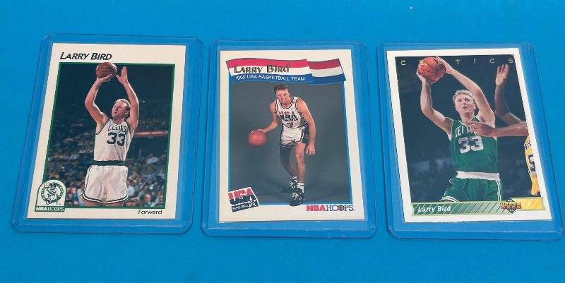 View 1 of 026118…3 Larry Bird cards in hard plastic sleeves 