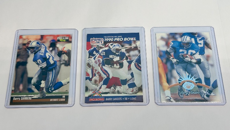 Photo 1 of 026129…3 Barry Sanders cards in hard plastic sleeves