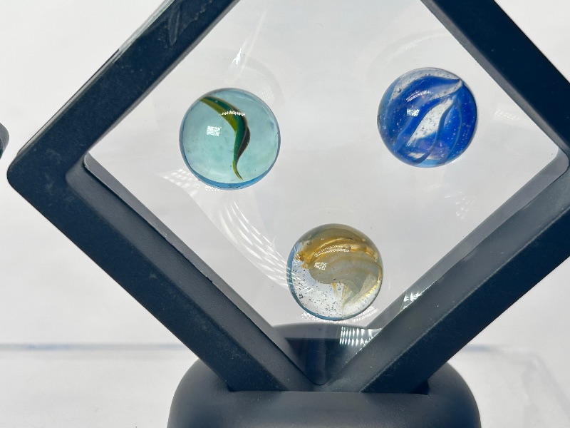 Photo 1 of 026150…vintage cat eye marbles in displays