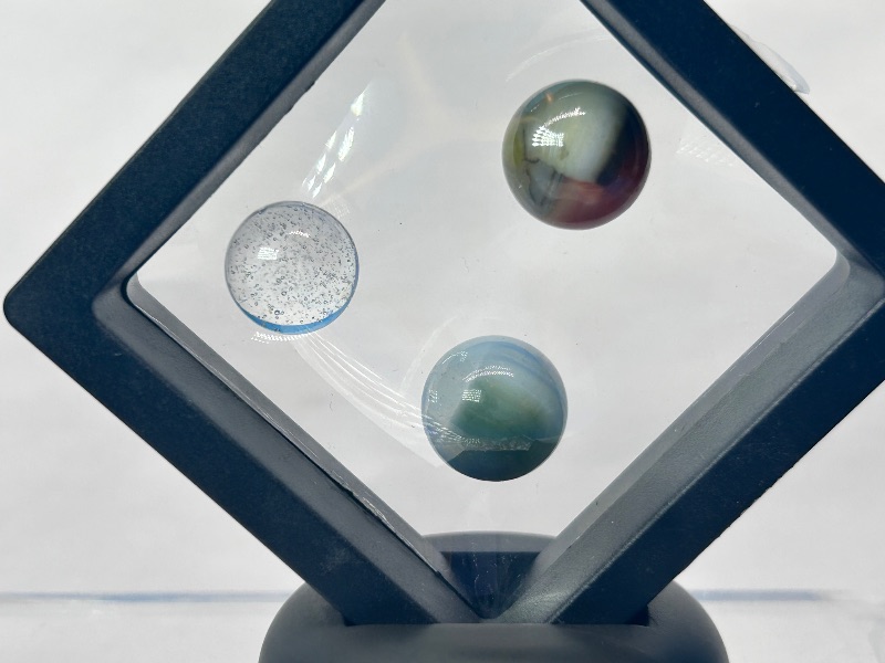 Photo 1 of 026151…vintage cat eye marbles in displays 