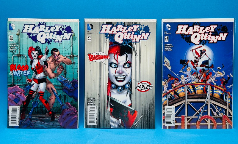 Photo 1 of 026179…3 Harley Quinn comics in plastic sleeves 