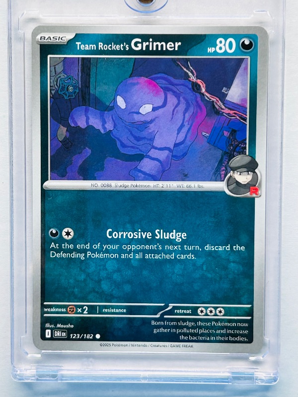 Photo 1 of 026236…Team Rocket’s Grimer Pokemon card in hard plastic case 