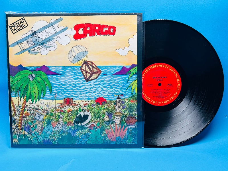 Photo 1 of 026337…Men At Work 33 RPM record in plastic sleeve- record and cover in great condition for age 