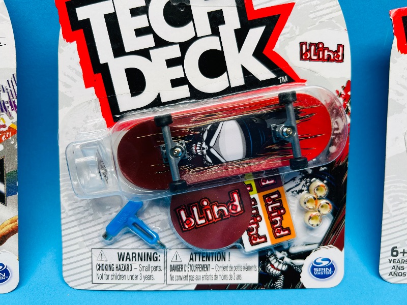 Photo 1 of 026348… 3 Tech Deck fingerboards 