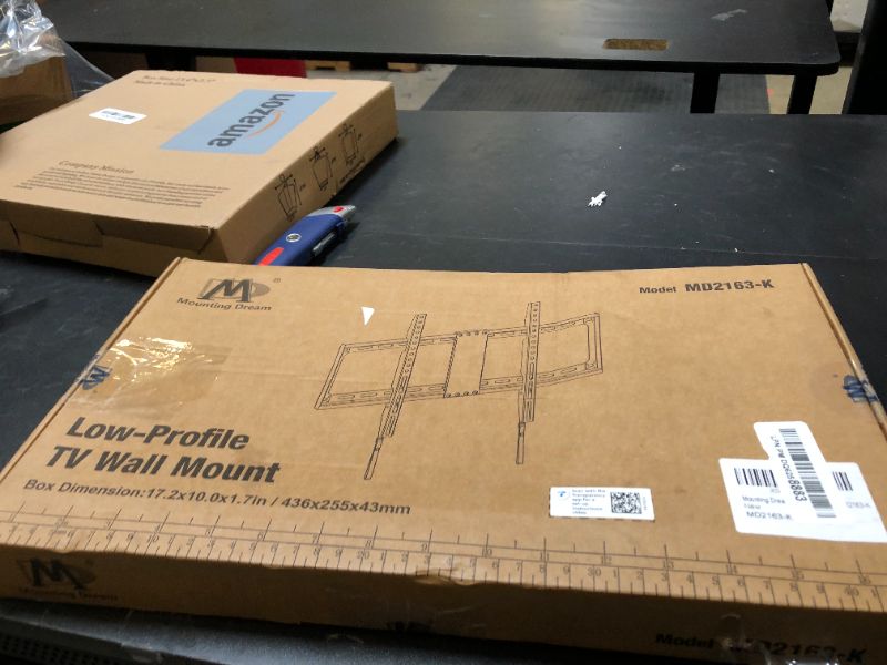 Photo 1 of Mounting Dream TV Mount Fixed for Most 42-84 Inch Flat Screen TVs, TV Wall Mount Bracket up to VESA 600 x 400mm and 132 lbs - Fits 16"/18"/24" Studs - Low Profile and Space Saving MD2163-K