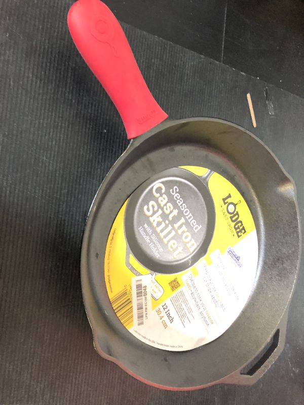 Photo 1 of Lodge 12 Inch Cast Iron Skillet with Red Silicone Hot Handle Holder – Pre-Seasoned Frying Pan for Stove, Oven, Grill & Campfire – Made in the USA – Durable, Nonstick Cast Iron Cookware – Black
