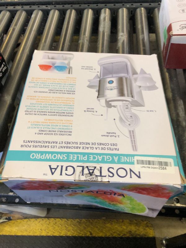 Photo 1 of Nostalgia SnowPro Electric Shaved Ice & Snow Cone Maker 64-Ounce Ice Shaving Capacity, 4 Reusable Cones, Side Shelves, and Scoop Included
