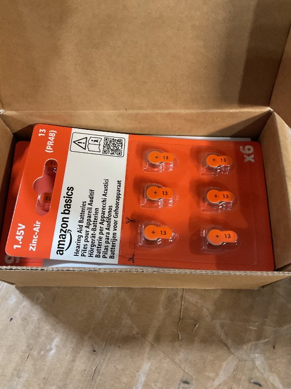 Photo 1 of Amazon Basics 60-Pack Hearing Aid Size 13 Zinc-Air Batteries, 1.45 Volt, Orange Tab, 4-Year Shelf Life, Child-Safe Package (Use Scissors to Open)