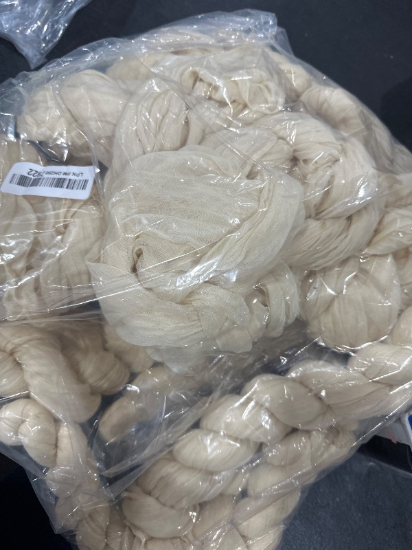 Photo 1 of DeZerlor Beige Cheesecloth Table Runner 12 Pack Spring Sheer Cream Cheese Cloth Table Runners Gauze 120 Inches Long Boho Easter Table Decorations for Wedding Bridal Baby Shower Garden Party Decor