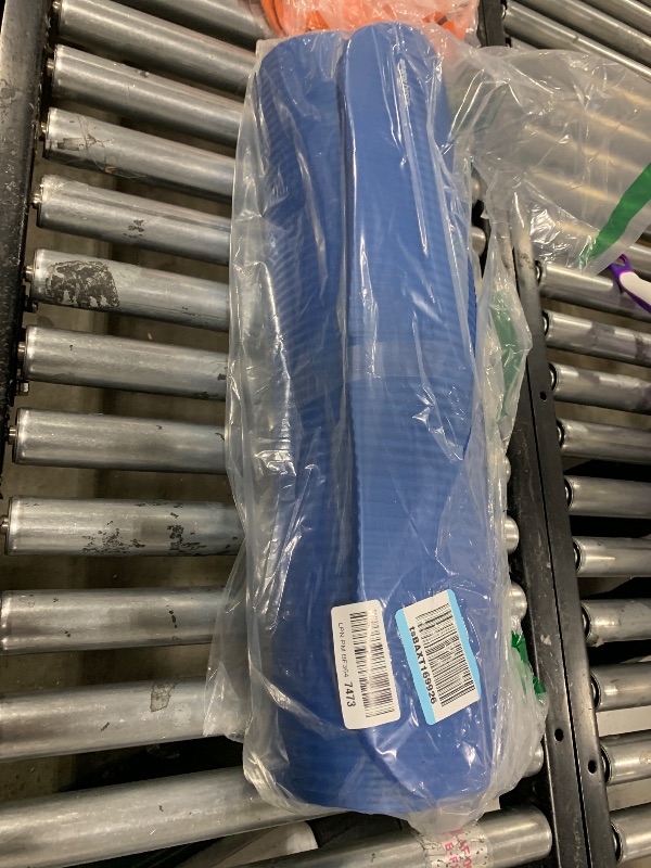 Photo 1 of Amazon Basics Extra Thick Exercise Yoga Gym Floor Mat with Carrying Strap, 74 x 24 x .5 Inches, Blue