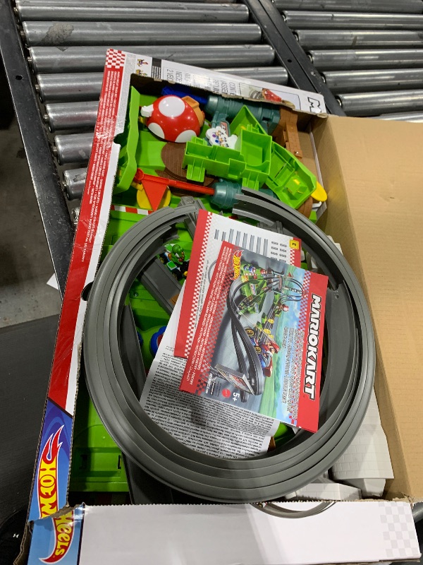 Photo 1 of Hot Wheels Mario Kart Circuit Track Set & 2 Toy Vehicles, Racing Playset Includes Booster, Plus Mario & Yoshi Karts (Amazon Exclusive)