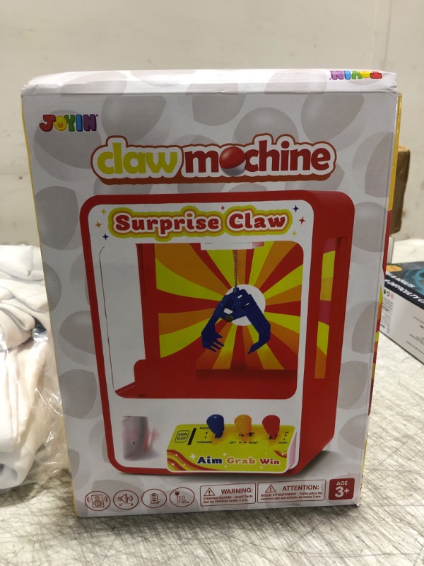 Photo 1 of JOYIN Claw Machine Arcade Toy with LED Light & Adjustable Sound, Rechargable Dispenser Toys Mini Vending Machine for Kids - Perfect Christmas & Birthday Big Gifts for Kids, Ages 3+
