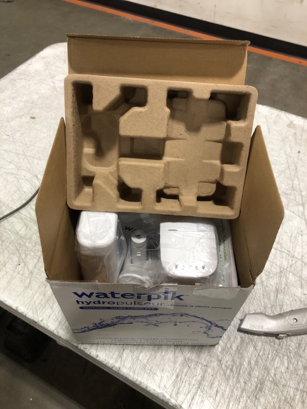 Photo 1 of Waterpik Sensonic Complete Care Water Flosser and Rechargeable Electric Toothbrush Combo Set for Teeth Cleaning and Flossing, CC-04, White, Packaging May Vary