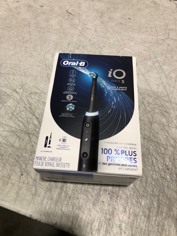 Photo 2 of Oral-B iO Series 5 Rechargeable Electric Toothbrush with Visible Pressure Sensor to Protect Gums, 2 Minute Timer, 5 Cleaning Settings, 1 Replacement Toothbrush Heads, and Travel Case, Black