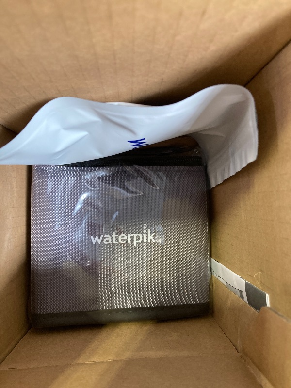 Photo 1 of Waterpik Evolution and Nano Water Flosser Combo Pack