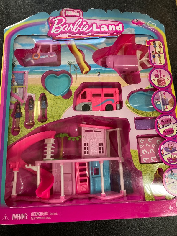 Photo 2 of Barbie Mini BarbieLand DreamHouse & 3-Vehicle Playset with 4 1.5-Inch Dolls, Doll House Furniture & Accessories, Includes DreamCamper, Boat & Plane