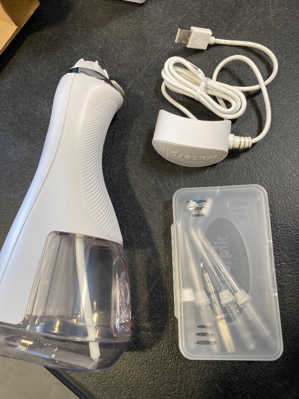 Photo 1 of Waterpik Cordless Advanced 2.0 Water Flosser For Teeth, Gums, Braces, Dental Care With Travel Bag and 4 Tips, ADA Accepted, Rechargeable, Portable, and Waterproof, White WP-580, Packaging May Vary