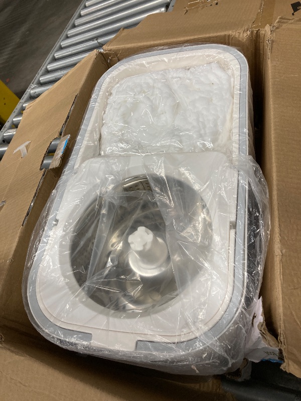 Photo 1 of ***LARGE CRACK IN BUCKET/PARTS ONLY***360° Revolution Spin Mop and Bucket Carrier with Built-in Wringer and Cleaning System with Adjustable Stainless Steel Handle (5 Replacement Heads Included) Four Hidden Wheels at The Bottom
