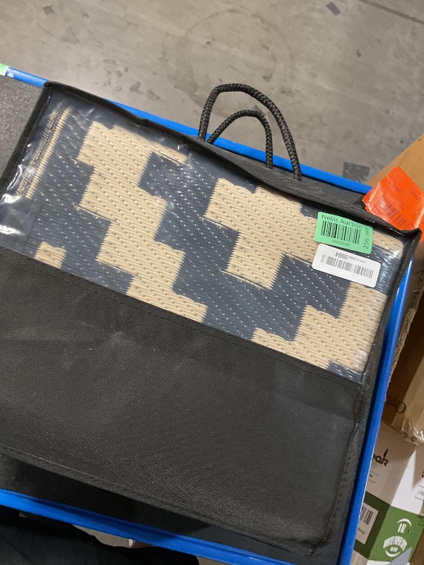 Photo 1 of Smiry Waterproof Outdoor Rug 6x9 ft, Reversible Plastic Straw Patio Camping Rugs, Outdoor Indoor RV Mat Carpet for Patio, Outside Entry, Backyard, Deck, Bench, Picnic, Camper, Black & Beige