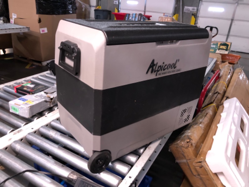 Photo 1 of ***MAJOR DAMAGE - WHEEL BROKEN OFF - POWERS ON - UNABLE TO TEST FURTHER - NO PACKAGING - SEE PICTURES***
Alpicool T60 Dual Temperature Control 12 Volt Refrigerator 63 Quart Portable Car Fridge Freezer (-4°F~68°F) for Truck, RV, Boat, Camping and Travel