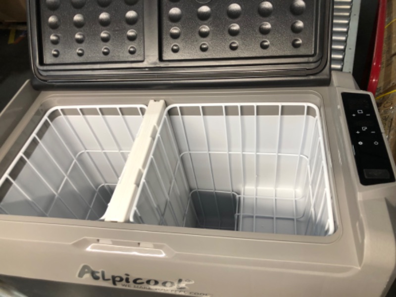 Photo 1 of ***MAJOR DAMAGE - WHEEL BROKEN OFF - POWERS ON - UNABLE TO TEST FURTHER - NO PACKAGING - SEE PICTURES***
Alpicool T60 Dual Temperature Control 12 Volt Refrigerator 63 Quart Portable Car Fridge Freezer (-4°F~68°F) for Truck, RV, Boat, Camping and Travel
