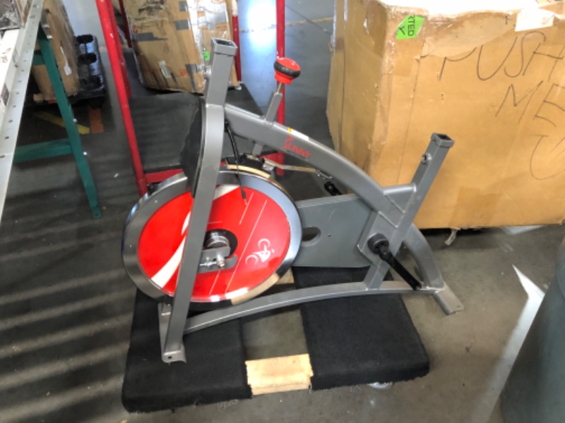 Photo 1 of ***INCOMPLETE - DAMAGED - MISSING MOST OF THE PARTS - SEE PICTURES***
Sunny Health & Fitness Indoor Cycling Exercise Bike with Heavy-Duty 49 LB Chrome Flywheel, Stationary Bike with Customizable Comfort with 275 LBS. Max Weight - ?SF-B1002