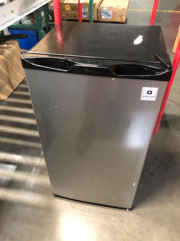 Photo 1 of ***USED - SCUFFED AND SCRAPED - POWERS ON - UNABLE TO TEST FURTHER***
ARCTIC CHEF ACFR322 RCA Mini Refrigerator, Compact Freezer Compartment, Adjustable Thermostat Control, Reversible Door, Ideal Fridge for Dorm, Office, Apartment, Platinum Stainless, 3.2