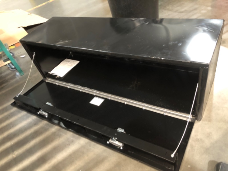 Photo 1 of ***MAJOR DAMAGE - COVERED IN DENTS - SEE PICTURES - NO PACKAGING***
Buyers Products 1702115 Steel Underbody Truck Box with Lockable Paddle Latch, 18x 18x 60 Inch, for Work/ Utility Truck, Heavy Duty Truck Bed Box, Made in the USA, Black