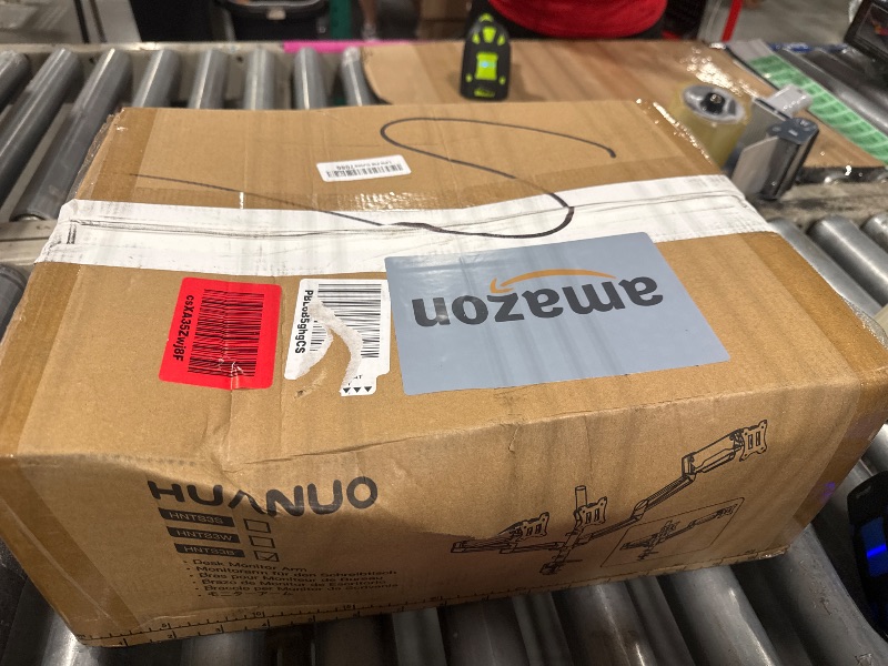 Photo 1 of HUANUO Triple Monitor Mount for 17 to 32 inch Screens, Gas Springs Adjustment Triple Monitor Stand with Swivel, Tilt, Rotation, Clamp & Grommet Kit (Black)