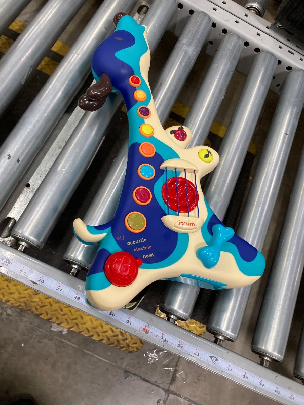 Photo 1 of B. toys- Woofer- Interactive Dog Guitar- Musical Toys- 3 Music Modes- Big & Colorful Buttons – 2 Years +