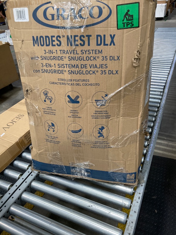 Photo 1 of Graco® Modes™ Nest DLX 3-in-1 Travel System  ***(OPEN BOX, BOX RIPPED/TORN)***