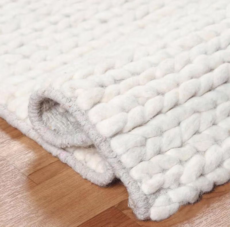 Photo 1 of ***DIRTY, UNSURE OF EXACT MEASURMENTS***   FRELISH DECOR Wool Cotton Area Rug for Living Room and Bedroom, 5'x8' Handwoven Braided Chunky Knit Cable Rugs, Farmhouse Contemporary Area Rug: Ivory
