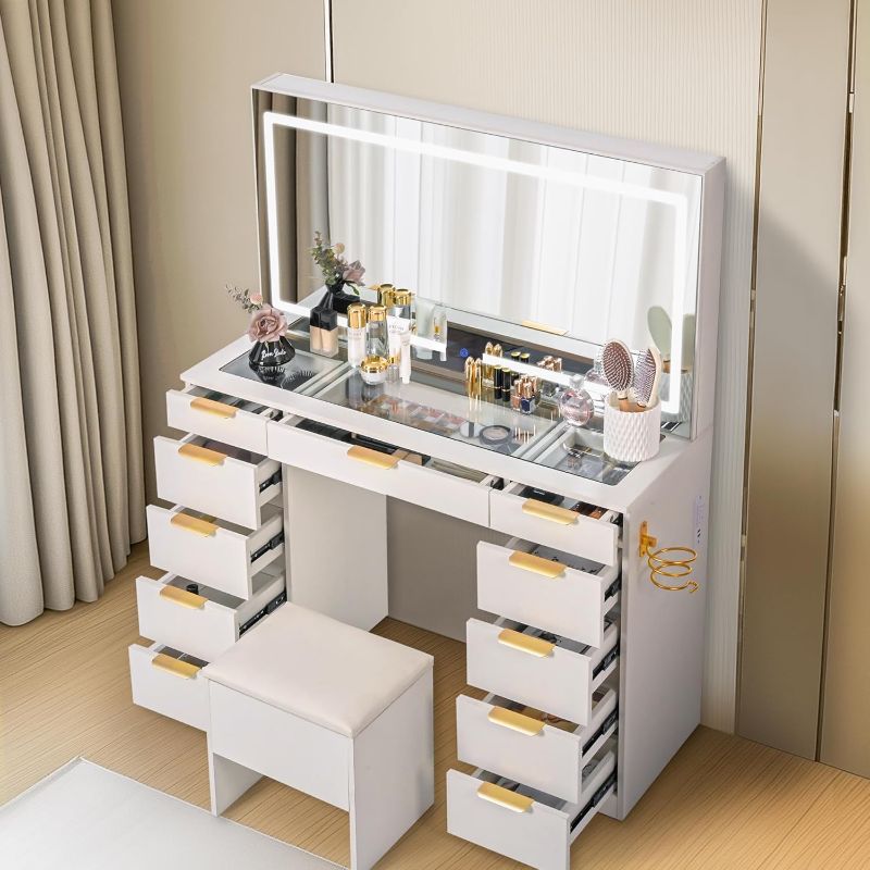 Photo 1 of SIMILAR ITEM
Pamapic 11 Drawers Vanity Desk with Golden Handles, Upgraded Silent Slides Vanity Mirror with Lights, 3 Lighting Modes Glass Top Makeup Vanity with Chair and Portable Mirror, Charging Station