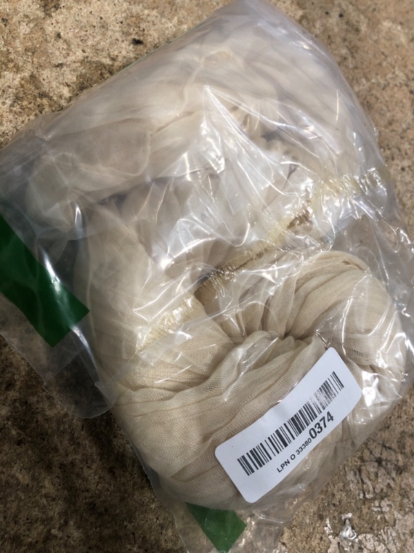 Photo 1 of DeZerlor Beige Cheesecloth Table Runner Spring Sheer Cream Cheese Cloth Table Runner Gauze 120 Inches Long Boho Summer Table Decorations for Wedding Bridal Baby Shower Garden Party Decor