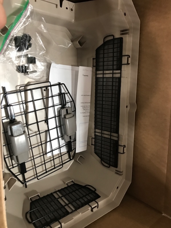 Photo 1 of Amazon Basics Hard-Sided Dog and Cat Kennel Single-Door Travel Pet Carrier with Metal Wire Ventilation, 23.6"L x 15.7"W x 13.0"H, Beige