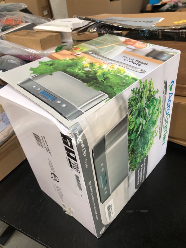 Photo 1 of AeroGarden Harvest Elite Indoor Garden Hydroponic System with LED Grow Light and Seed Kit, Holds up to 6 Pods, Stainless Steel